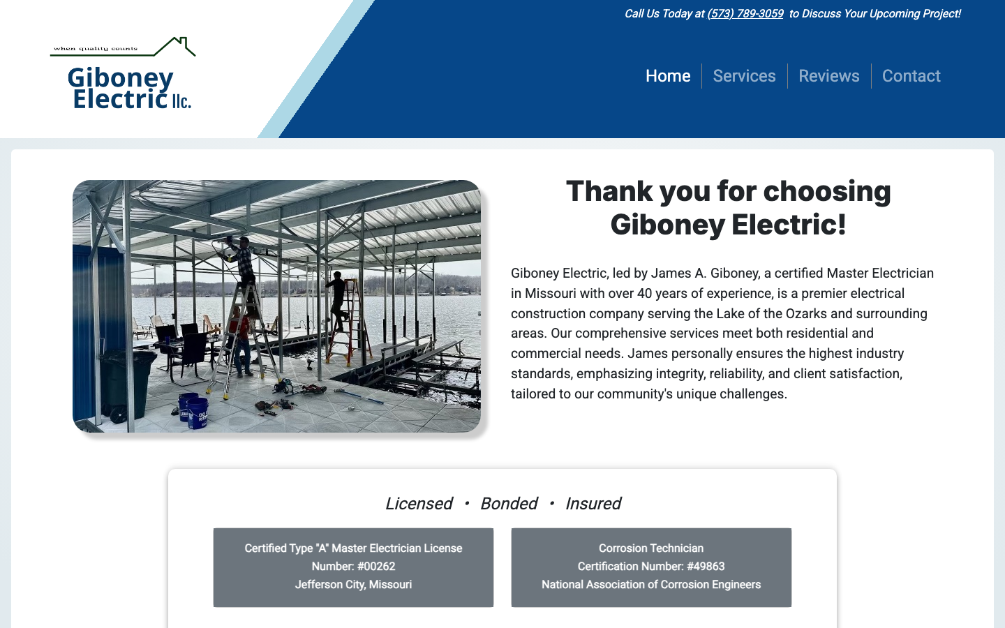 Giboney Electric home page on a desktop browser, with a photo of electricians wiring a boat dock on the lake.